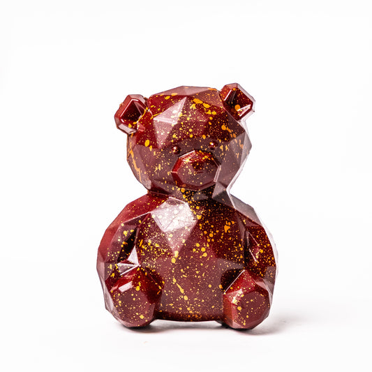 Red crystal bear figurine on a white background